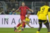 Dortmund's Nico Schlotterbeck and Bayern's Harry Kane challenge for the ball during the German Bundesliga soccer match between Borussia Dortmund and Bayern Munich at the Signal-Iduna Park in Dortmund, Germany, Saturday, Nov. 30, 2024. (AP Photo/Martin Meissner)