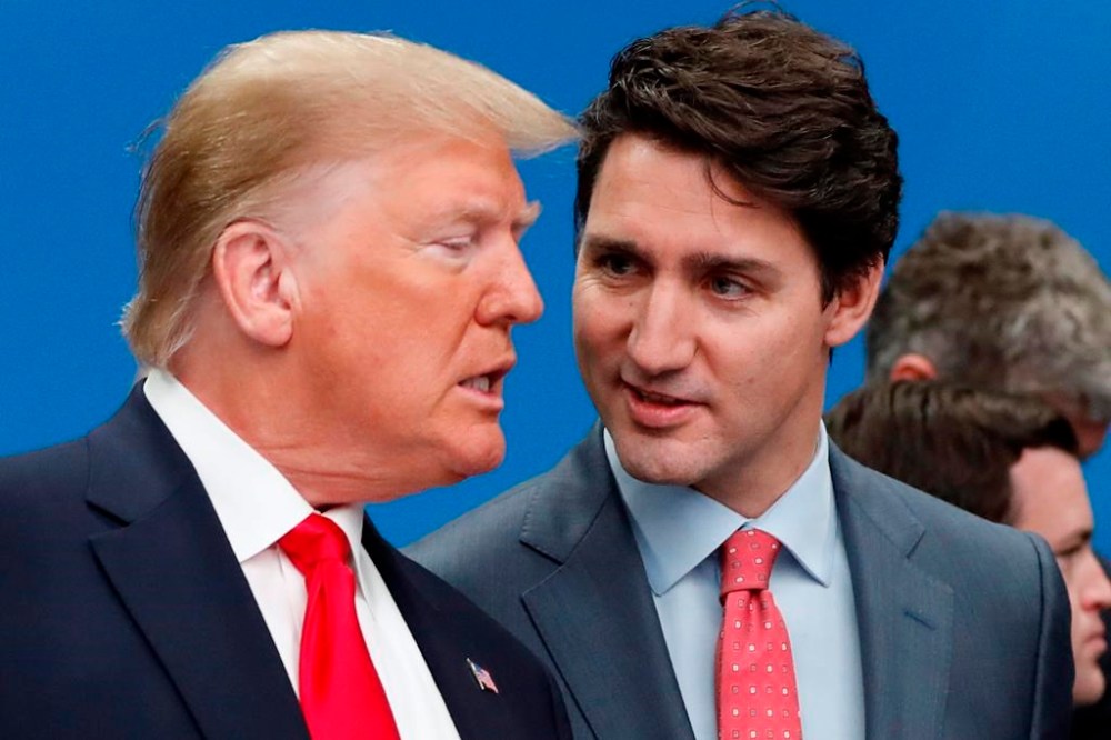 U.S. President Donald Trump, left, and Canadian Prime Minister Justin Trudeau talk before to a NATO roundtable meeting in Watford, Hertfordshire, England, Wednesday, Dec. 4, 2019. THE CANADIAN PRESS/AP-Frank Augstein