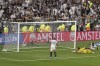 Junior Santos of Brazil's Botafogo, right, scores his his side's third goal against Brazil's Atletico Mineiro during a Copa Libertadores final soccer match at Monumental stadium in Buenos Aires, Argentina, Saturday, Nov. 30, 2024. (AP Photo/Natacha Pisarenko)