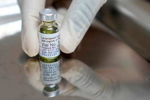 FILE - A pharmacist holds a vial of lenacapavir, the new HIV prevention injectable drug, at the Desmond Tutu Health Foundation's Masiphumelele Research Site, in Cape Town, South Africa, Tuesday, July 23, 2024, which was one of the sites for Gilead's lenacapavir drug trial. (AP Photo/Nardus Engelbrecht, File)
