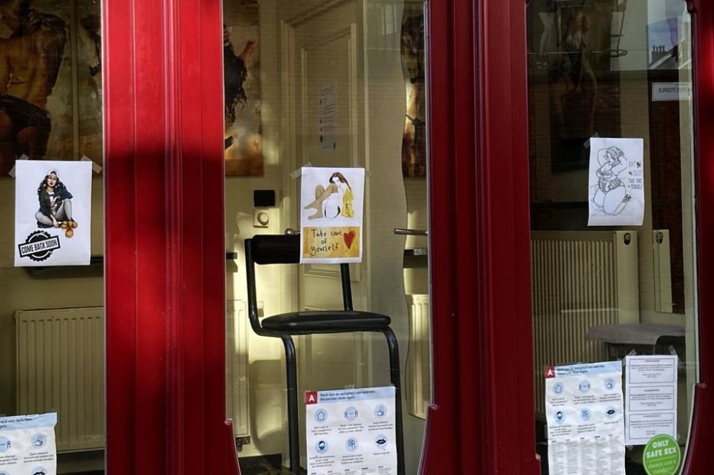 A view of an empty chair inside of a sex worker's booth, in Antwerp, Belgium, Tuesday, Nov. 3, 2020. (AP Photo/Virginia Mayo, File)