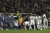 Fiorentina's Edoardo Bove, injured, is surrounded by players during the Serie A soccer match between Fiorentina and Inter at the Artemio Franchi Stadium in Florence, Italy, Sunday Dec. 1, 2024 (Massimo Paolone/LaPresse via AP)