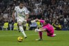 Real Madrid's Kylian Mbappe runs with the ball in an attempt to score during the Spanish La Liga soccer match between Real Madrid and Getafe at the Santiago Bernabeu Stadium in Madrid, Spain, Sunday, Dec. 1, 2024. (AP Photo/Bernat Armangue)