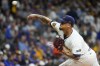 FILE -Milwaukee Brewers pitcher Frankie Montas throws during the first inning of Game 2 of a National League wild card baseball game against the New York Mets, Oct. 2, 2024, in Milwaukee. (AP Photo/Morry Gash, File)