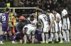 Fiorentina's Edoardo Bove, injured, is surrounded by players after collapsing during the Serie A soccer match between Fiorentina and Inter at the Artemio Franchi Stadium in Florence, Italy, Sunday Dec. 1, 2024 (Massimo Paolone/LaPresse via AP)