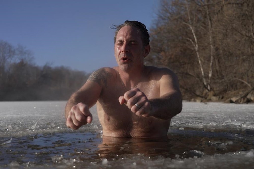 Jeff Tait, of Hastings, Minn., cools off after a session in a Saunable mobile sauna at Lebanon Hills Regional Park in Eagan, Minn. on Sunday, Dec. 1, 2024. (AP photo/Mark Vancleave)