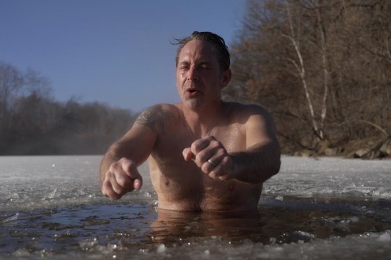 Jeff Tait, of Hastings, Minn., cools off after a session in a Saunable mobile sauna at Lebanon Hills Regional Park in Eagan, Minn. on Sunday. (Mark Vancleave / The Associated Press)