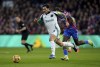 Newcastle United's Sandro Tonali, left, and Crystal Palace's Ismaila Sarr battle for the ball during the English Premier League soccer match between Crystal Palace and Newcastle United at Selhurst Park, London, Saturday Nov. 30, 2024. (Ben Whitley/PA via AP)
