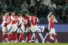Arsenal's Gabriel Martinelli, right, celebrates after scoring the opening goal during the Champions League opening phase soccer match between Sporting CP and Arsenal at the Alvalade stadium in Lisbon, Tuesday, Nov. 26, 2024. (AP Photo/Armando Franca)
