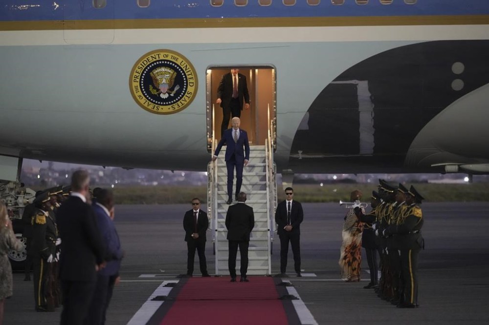 President Joe Biden walks from Air Force One as he arrives at Quatro de Fevereiro international airport in the capital Luanda, Angola on Monday, Dec. 2, 2024, on his long-promised visit to Africa. (AP Photo/Ben Curtis)