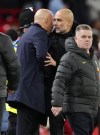 Manchester City manager Pep Guardiola and Liverpool manager Arne Slot talk following an English Premier League soccer match at Anfield Stadium, Liverpool, England, Sunday Dec. 1, 2024. (Peter Byrne/PA via AP)