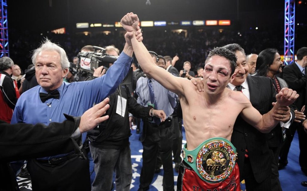 FILE - Referee Pat Russell raises the arm of Israel Vázquez of Mexico after he defeated Rafael Marquez of Mexico in their WBC super bantamweight championship bout, in Carson, Calif., March. 1, 2008. The World Boxing Council (WBC) president confirmed on Tuesday, Dec. 3, 2024, that Israel Vázquez, a Mexican fighter who won three world titles in his boxing career, has died. He was 46. (AP Photo/Mark J. Terrill, File)