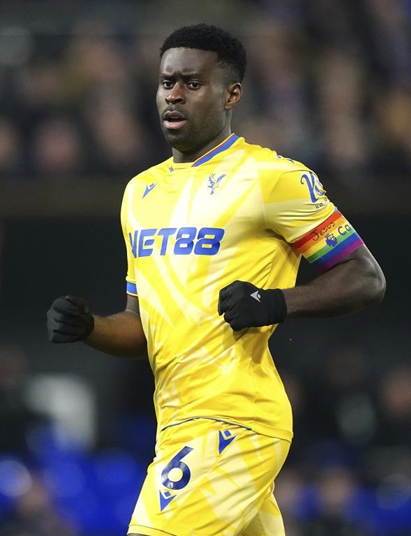 Crystal Palace's Marc Guehi wears the Rainbow Laces captain's armband which has the words 'Jesus Heart You' on during the England Premier League soccer match between Ipswich Town and Crystal Palace at Portman Road, Ipswich, England, Tuesday, Dec. 3, 2024. (Zac Goodwin/PA via AP)