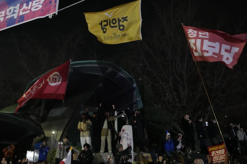 People gather in front of the National Assembly in Seoul, South Korea, Wednesday, Dec. 4, 2024. (AP Photo/Ahn Young-joon)