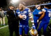 Winnipeg Blue Bombers general manager Kyle Walters, left, congratulates Tony Jones (33) after defeating the Saskatchewan Roughriders in the CFL Western Conference final in Winnipeg Saturday, Nov. 9, 2024. The Blue Bombers have signed American linebacker Jones to a two-year contract extension, the CFL club announced Wednesday.  THE CANADIAN PRESS/John Woods