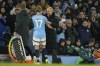 Manchester City's head coach Pep Guardiola, right, greets Kevin De Bruyne during a substitution at the English Premier League soccer match between Manchester City and Nottingham Forest at the Etihad Stadium in Manchester, Wednesday, Dec. 4, 2024. (AP Photo/Dave Thompson)