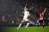 Real Madrid's Jude Bellingham celebrates after scoring his sides first goal during the Spanish La Liga soccer match between Athletic Bilbao and Real Madrid at the San Mames stadium in Bilbao, Spain, Wednesday, Dec. 4, 2024. (AP Photo/Miguel Oses)