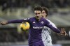 Fiorentina's Luca Ranieri fights for the ball with Empoli's Luca Belardinelli during an Italian Cup soccer match between Fiorentina and Empoli at Artemio Franchi stadium, Wednesday, Dec. 4, 2024, in Florence, Italy. (Massimo Paolone/LaPresse via AP)