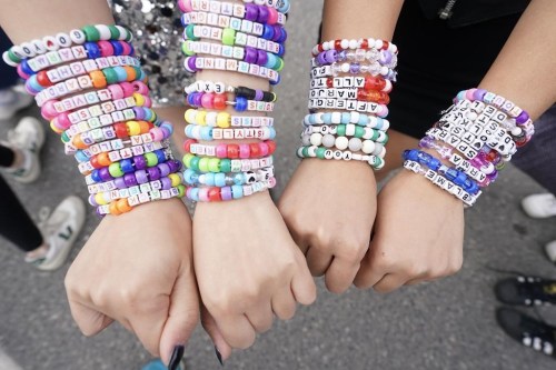 Fans display bracelets as they gather outside Toronto's Rogers Centre before going to see Taylor Swift perform in the opening show of the Toronto dates for her Eras Tour, on Thursday Nov. 14, 2024. THE CANADIAN PRESS/Chris Young
