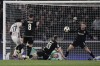Lille's Ngal'Ayel Mukau, left, scores the opening goal during the Champions League opening phase soccer match between Bologna FC 1909 and LOSC Lille in Bologna, Italy, Wednesday, Nov. 27, 2024. (Massimo Paolonei/LaPresse via AP)