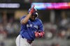 Toronto Blue Jays' Vladimir Guerrero Jr. celebrates his solo home run against the Texas Rangers in the seventh inning of a baseball game in Arlington, Texas, Thursday, Sept. 19, 2024. THE CANADIAN PRESS/AP-Tony Gutierrez