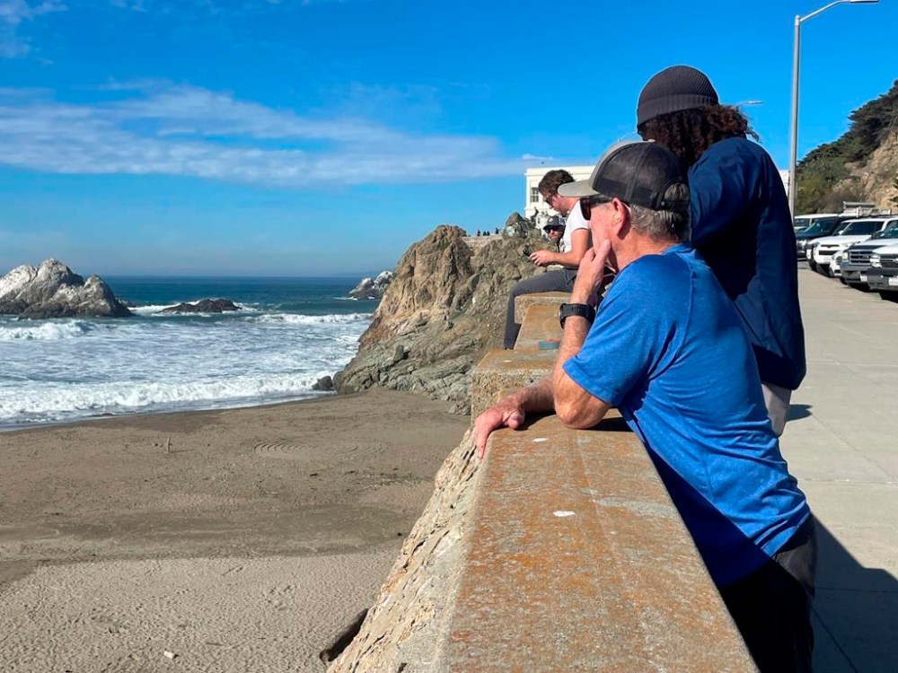 People watch the waves come in after an earthquake was felt widely across Northern California at Ocean Beach in San Francisco, Thursday, Dec. 5, 2024. (AP Photo/Haven Daley)
