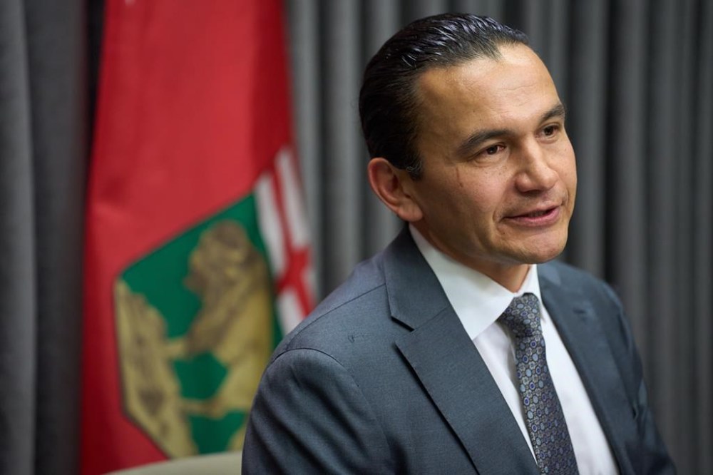 Manitoba Premier Wab Kinew speaks to the media at the Manitoba Legislative Building in Winnipeg, Tuesday, Nov. 19, 2024. THE CANADIAN PRESS/David Lipnowski