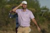 Scottie Scheffler, of the United States, reacts at the end of the second round of the Hero World Challenge PGA Tour at the Albany Golf Club in New Providence, Bahamas, Friday, Dec. 6, 2024. (AP Photo/Fernando Llano)
