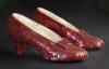 FILE - Sequin-covered ruby slippers worn by Judy Garland in 