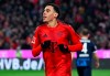 Munich's Jamal Musiala celebrates after scoring his side's fourth goal during the German Bundesliga soccer match between FC Bayern Munich and 1. FC Heidenheim 1846 in Munich, Germany, Saturday, Dec. 7, 2024. (Sven Hoppe/dpa via AP)