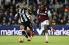 West Ham United's Michail Antonio, right, and Newcastle United's Joelinton, left, challenge for the ball during the English Premier League soccer match between Newcastle United and West Ham United in Newcastle, England, Monday, Nov. 25, 2024. (Richard Sellers/PA via AP)
