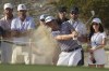 Justin Thomas, front, of the United States, watches his hit from the sand on the 16th hole during the third round of the Hero World Challenge PGA Tour at the Albany Golf Club in New Providence, Bahamas, Saturday, Dec. 7, 2024. (AP Photo/Fernando Llano)