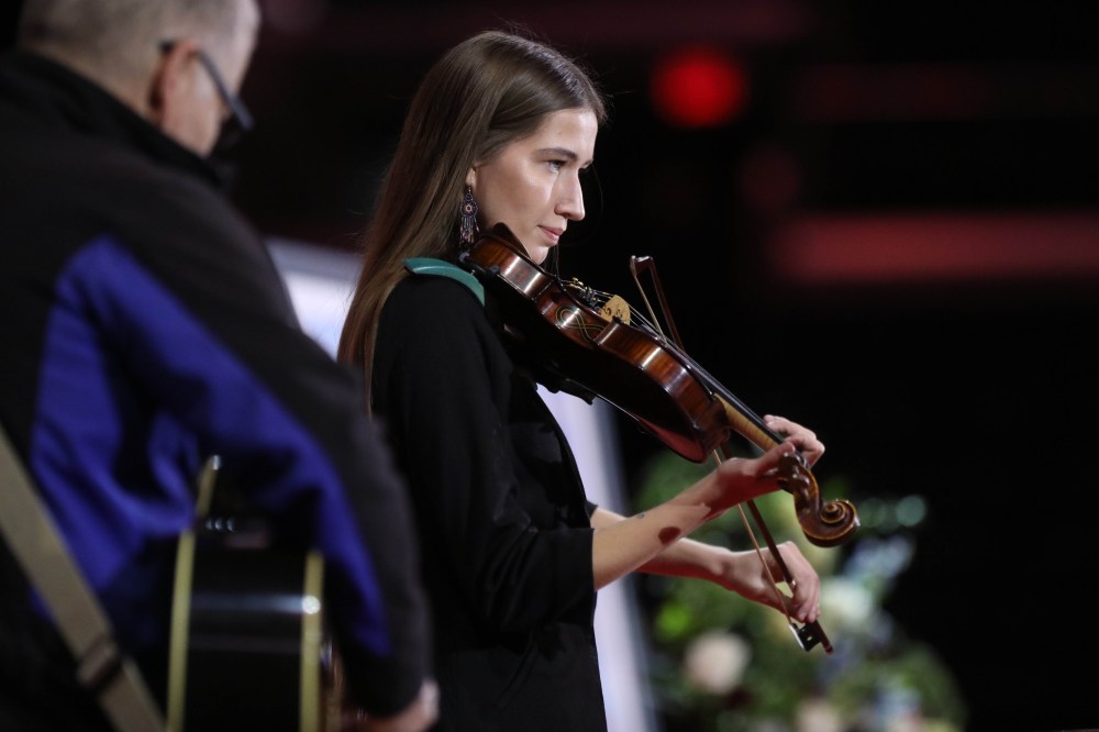 Métis fiddler Morgan Grace performs during the memorial service. (Ruth Bonneville / Free Press)