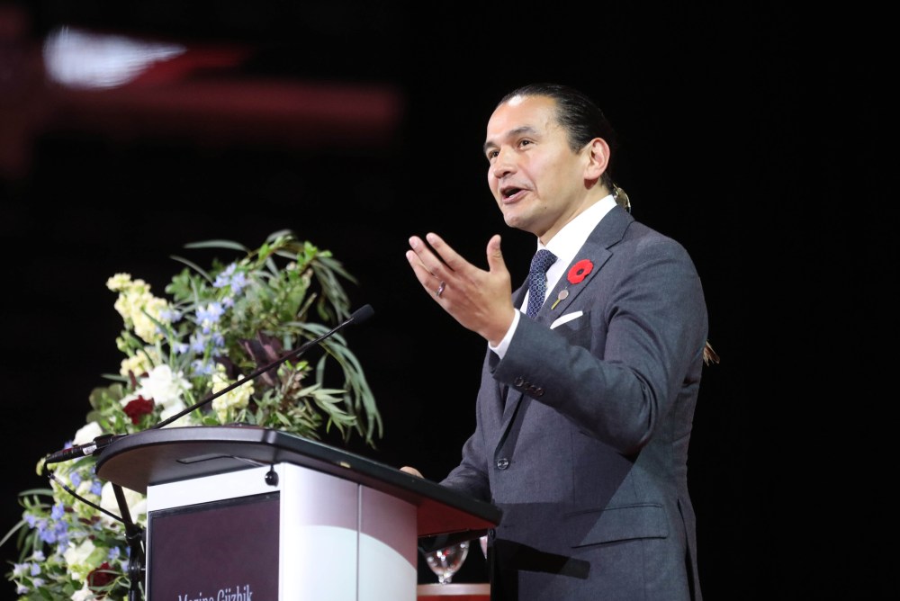 Manitoba Premier Wab Kinew speaks on stage during the service. (Ruth Bonneville / Free Press)