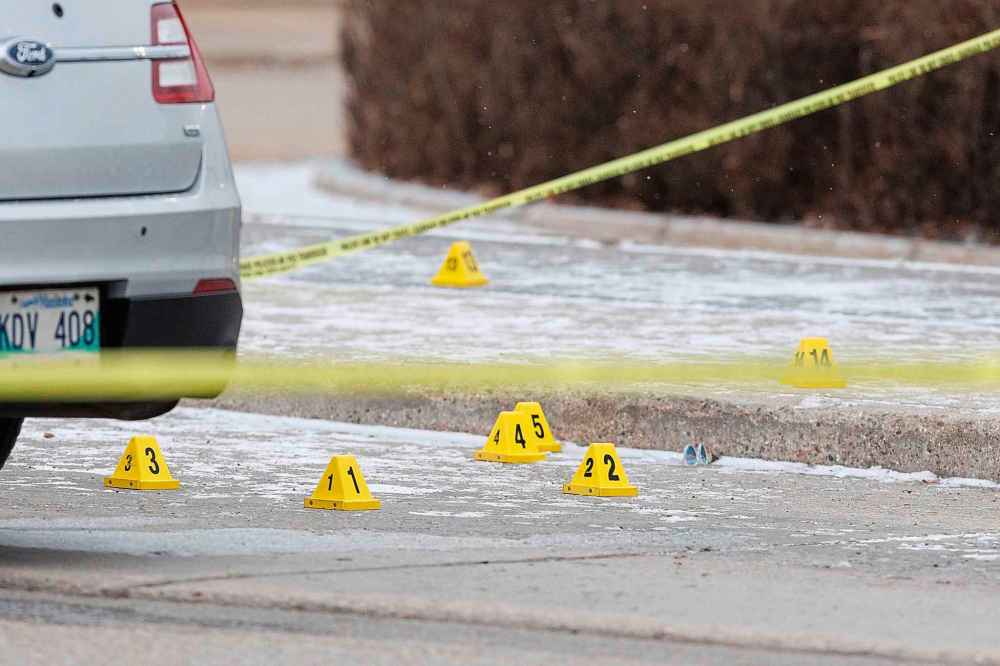 Winnipeg Police are still at the scene Monday morning at the bus stop in the parking lot of a Walmart at 3655 Portage Ave. where an officer-involved shooting occurred took place Sunday evening. (Mike Deal / Free Press)