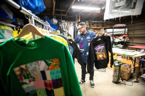 MIKAELA MACKENZIE / FREE PRESS
                                Roy Liang, the maker behind Winnipeg North of Fargo, shows quilted sweaters in his garage workshop space.