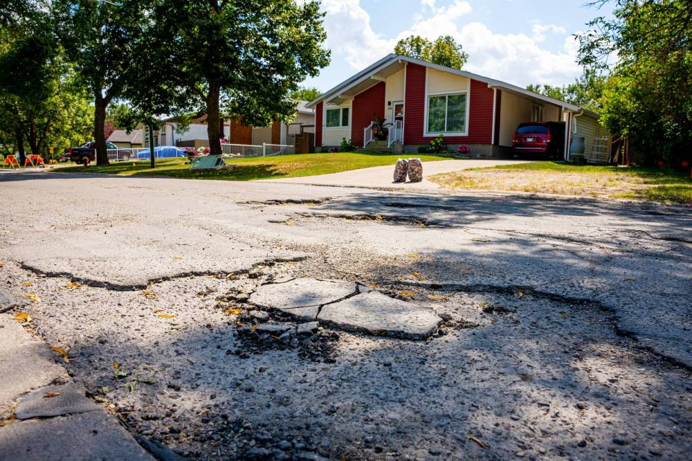 NIC ADAM / FREE PRESS
                                Potholes on Augusta Drive in Waverley Heights, as seen in mid-August.
