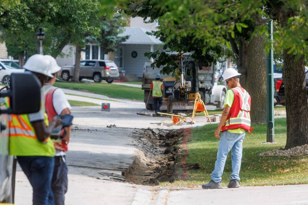 MIKE DEAL / FREE PRESS
                                Road construction crews work on the stretch of Augusta Drive between Lakeside and Chancellor drives in August.