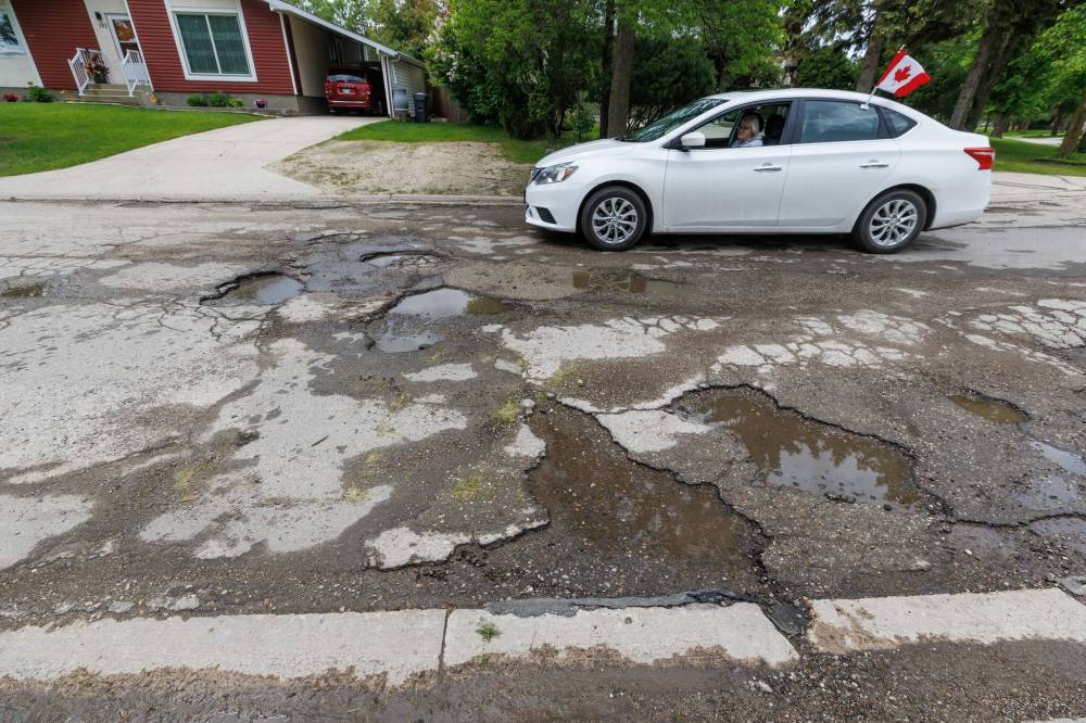 MIKE DEAL / FREE PRESS
                                The road conditions along the stretch of Augusta Drive between Lakeside and Chancellor drives are poor, in June.