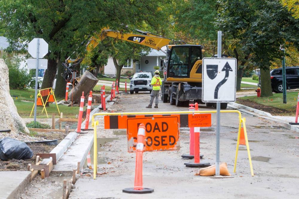 MIKE DEAL / FREE PRESS
                                Road construction crews work on the stretch of Augusta Drive between Lakeside and Chancellor drives in September.