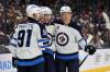 PAUL VERNON / THE ASSOCIATED PRESS
                                Winnipeg Jets forward Nikolaj Ehlers, centre, celebrates his second goal against the Columbus Blue Jackets with teammate forward Cole Perfetti, left, and forward Vladislav Namestnikov during the first period of an NHL hockey game in Columbus, Ohio, Friday. Ehlers scored three during the game and the Jets won 6-2.