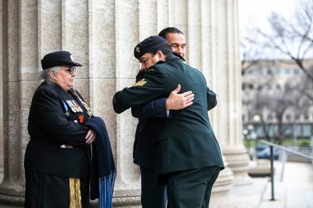 MIKAELA MACKENZIE / FREE PRESS
Premier Wab Kinew greets visitors at the entrance to the Manitoba Legislative Building to greet people after paying their respects to Murray Sinclair.