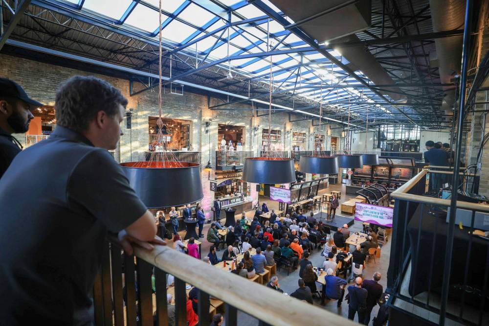 Ruth Bonneville / Free Press
People gather Tuesday in the riverside food hall in downtown Winnipeg for The Forks North Portage annual public meeting, where a focus was put on building up The Forks Foundation.