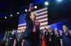 Former President Donald Trump waves as he walks with Melania Trump on election night at the Palm Beach Convention Center in West Palm Beach, Fla. (Evan Vucci / The Associated Press)