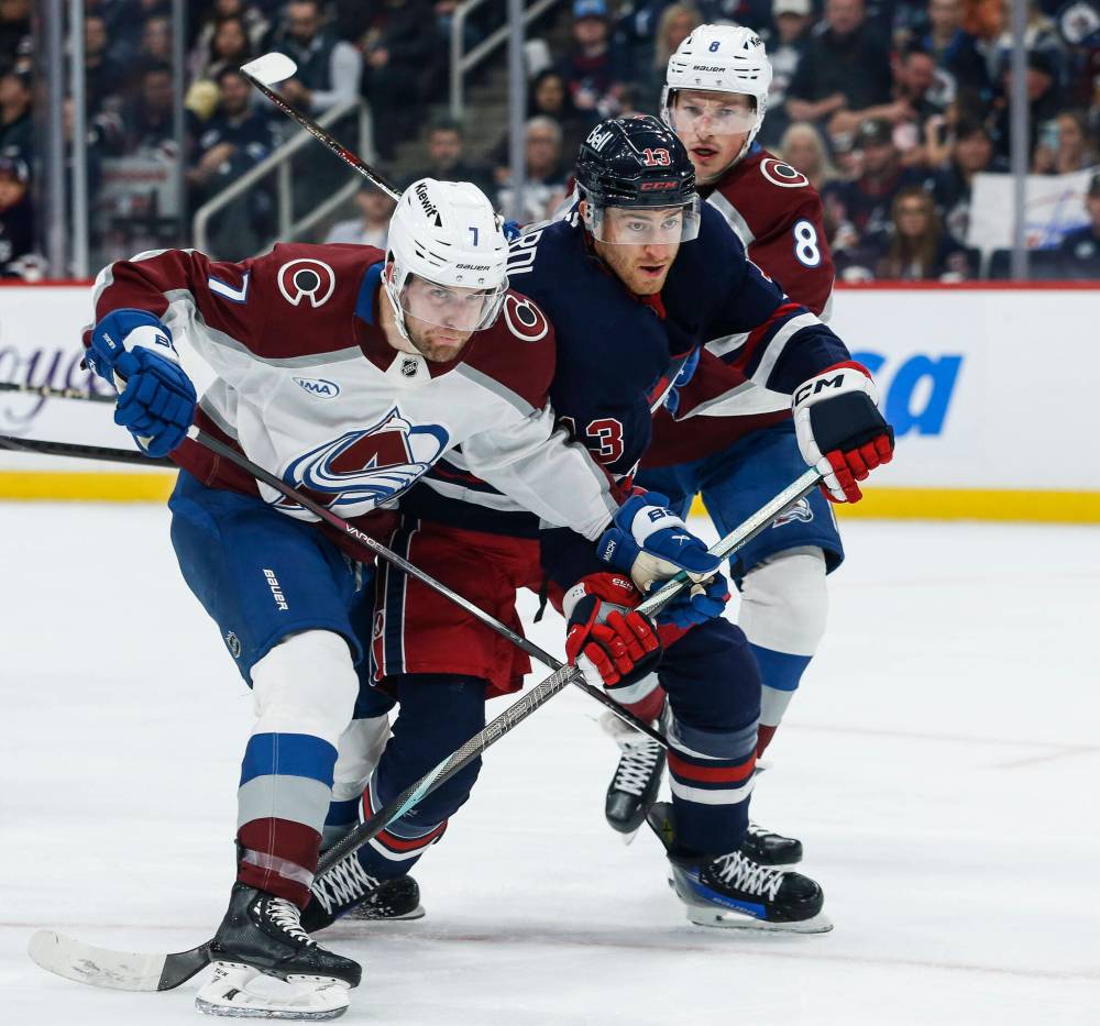 John Woods / THE CANADIAN PRESS
Winnipeg Jets’ Gabriel Vilardi fights through Colorado Avalanche’s Devon Toews, left, and Cale Makar during the second period.