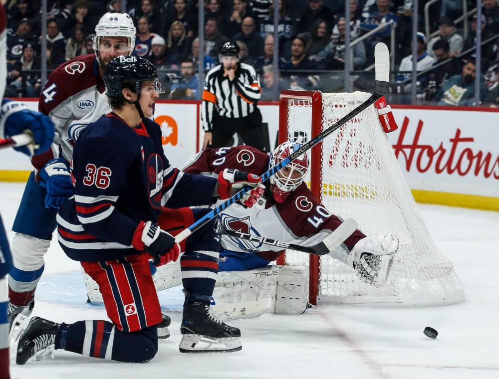 John Woods / THE CANADIAN PRESS
Colorado Avalanche goaltender Alexandar Georgiev makes a save on a shot from Winnipeg Jets’ Morgan Barron in the second period.