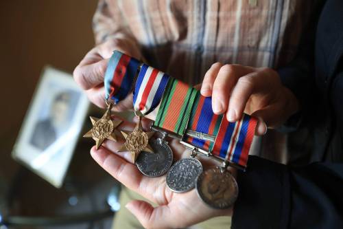 RUTH BONNEVILLE / FREE PRESS
                                Gus Wasiuta was proud to wear his medals and go through photo albums from his service years.
