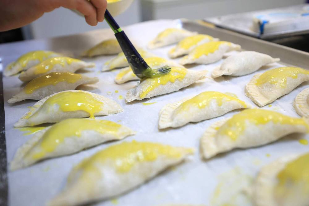 RUTH BONNEVILLE / FREE PRESS
In addition to the traditional beef filling, Café Lima offers empanadas filled with cheese and chicken, as well as a concoction Zegarra calls Manitoba — farmer sausage, bacon, dried blueberries, onions and garlic.