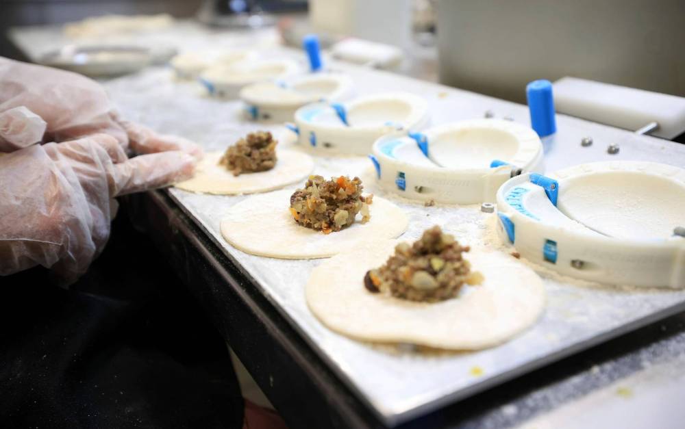 RUTH BONNEVILLE / FREE PRESS
To help Café Lima’s empanadas stand out from others available, Zegarra began importing various spices directly from Peru.