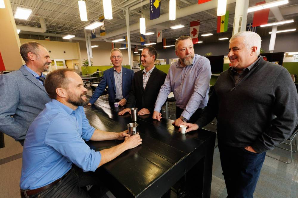 MIKE DEAL / FREE PRESS
Jack Abiusi (right) and his partners (From left): Peter Wertepny, Gary Hiebert, Mike Houvardas, Sebastien Lagasse, and Mark Melizza.